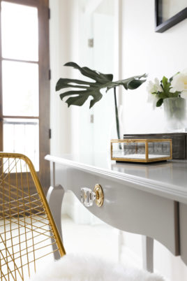 Custom brass and crystal detail in home plan designed by Hollie Whitehead