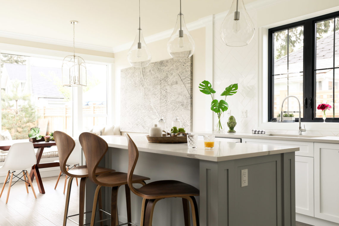 Grey and white farmhouse kitchen in single family home designed by Hollie Whitehead
